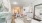 a large living room with a large mirror