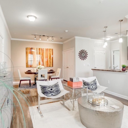 a large living room with a large mirror