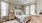 a bedroom with a bed and lamps