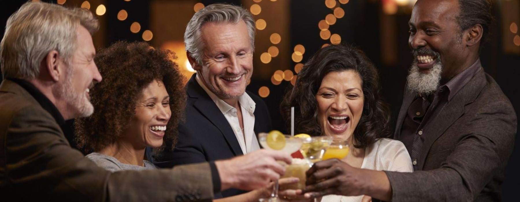 a group of people sitting at a table with drinks